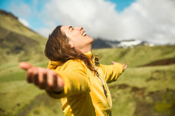 Woman contemplating a beautiful landscape